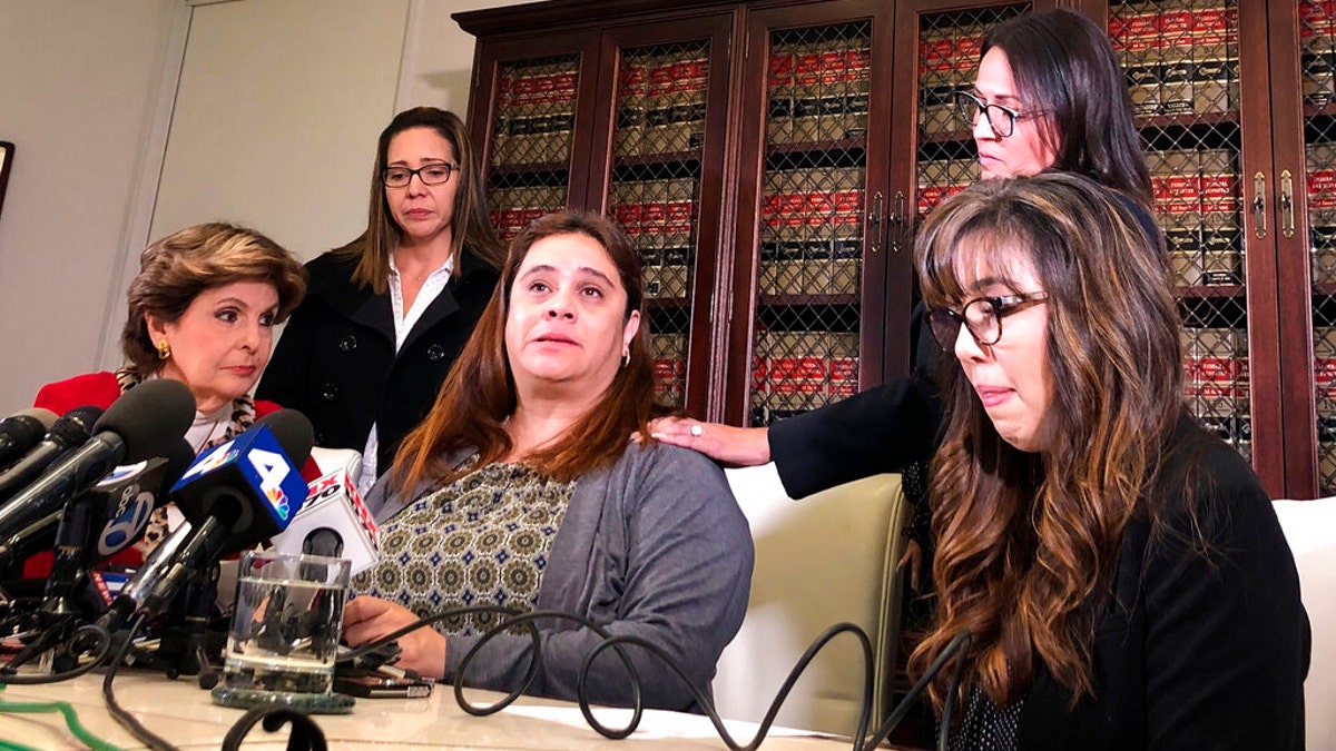 Attorney Gloria Allred, left, is seen with four Park Avenue Elementary School teachers at a Los Angeles news conference on Friday.