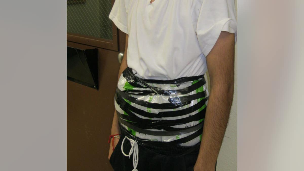 A 14-year-old boy was caught at the U.S.-Mexico border with crystal methamphetamine strapped to his waist Monday night, authorities said.