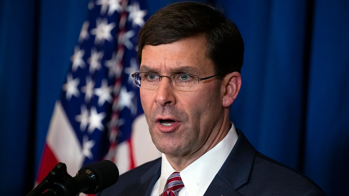 Secretary of Defense Mark Esper delivers a statement on Iraq and Syria, at President Donald Trump's Mar-a-Lago property, Sunday, Dec. 29, 2019, in Palm Beach, Fla. (AP Photo/ Evan Vucci)