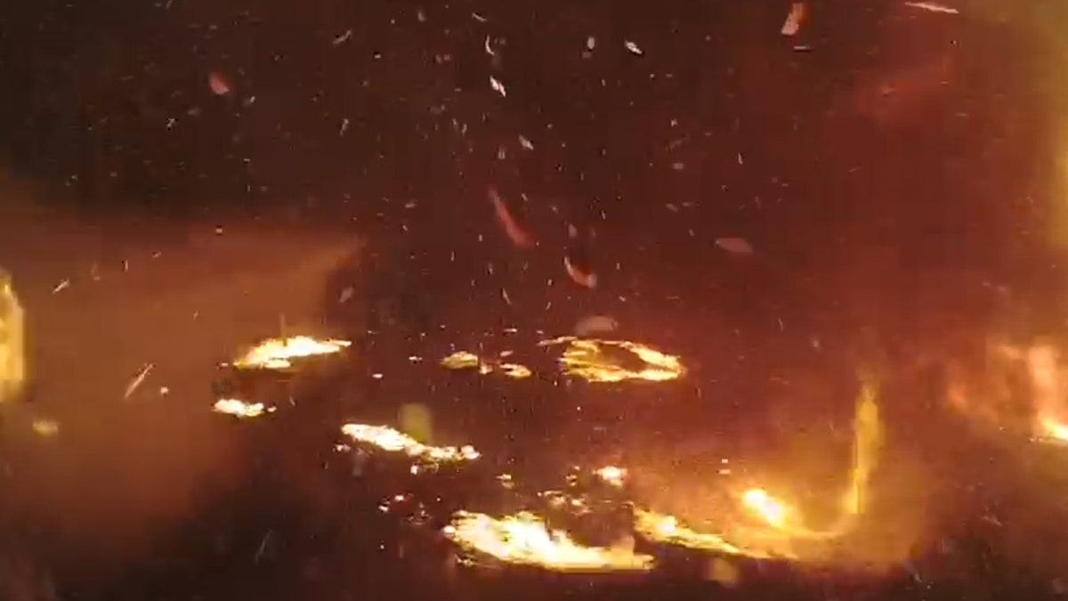 In a matter of minutes, the bush fire turned day into night and overtook an area in wall of flames.
