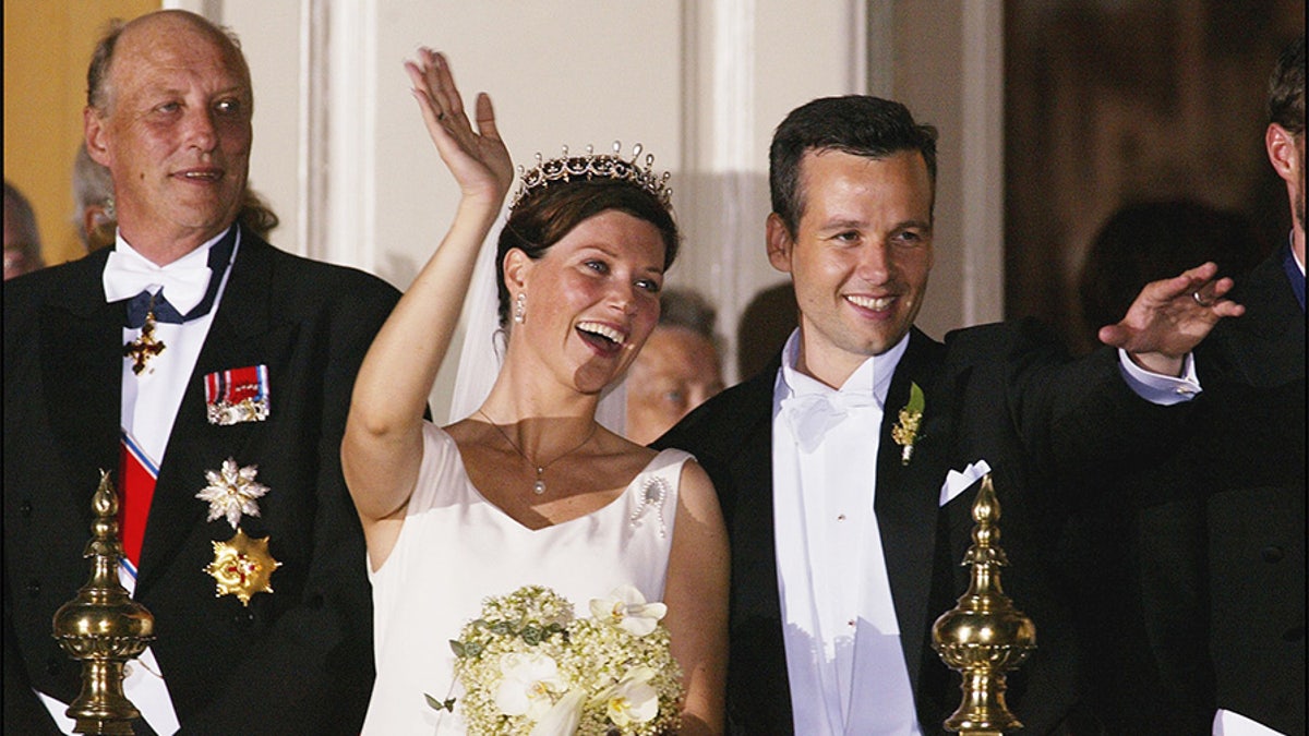 Wedding of Princess Martha Louise and Ari Behn in Trondheim, Norway on May 24, 2002 - Martha Louise and Ari Behn with their guest at the balcony for looking at a firework, left to right: King Harald, Martha Louise, Ari Behn.