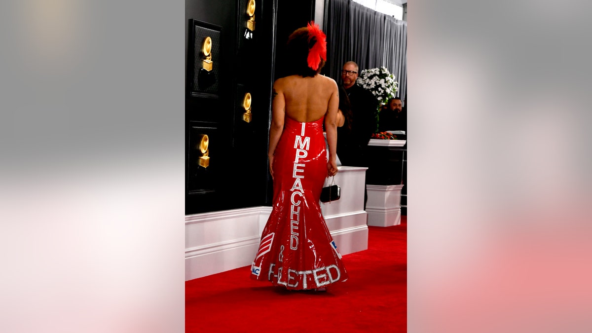 The back of Joy Villa's red gown spelled out "IMPEACHED" and "RE-ELECTED" at the Grammy Awards on Sunday.