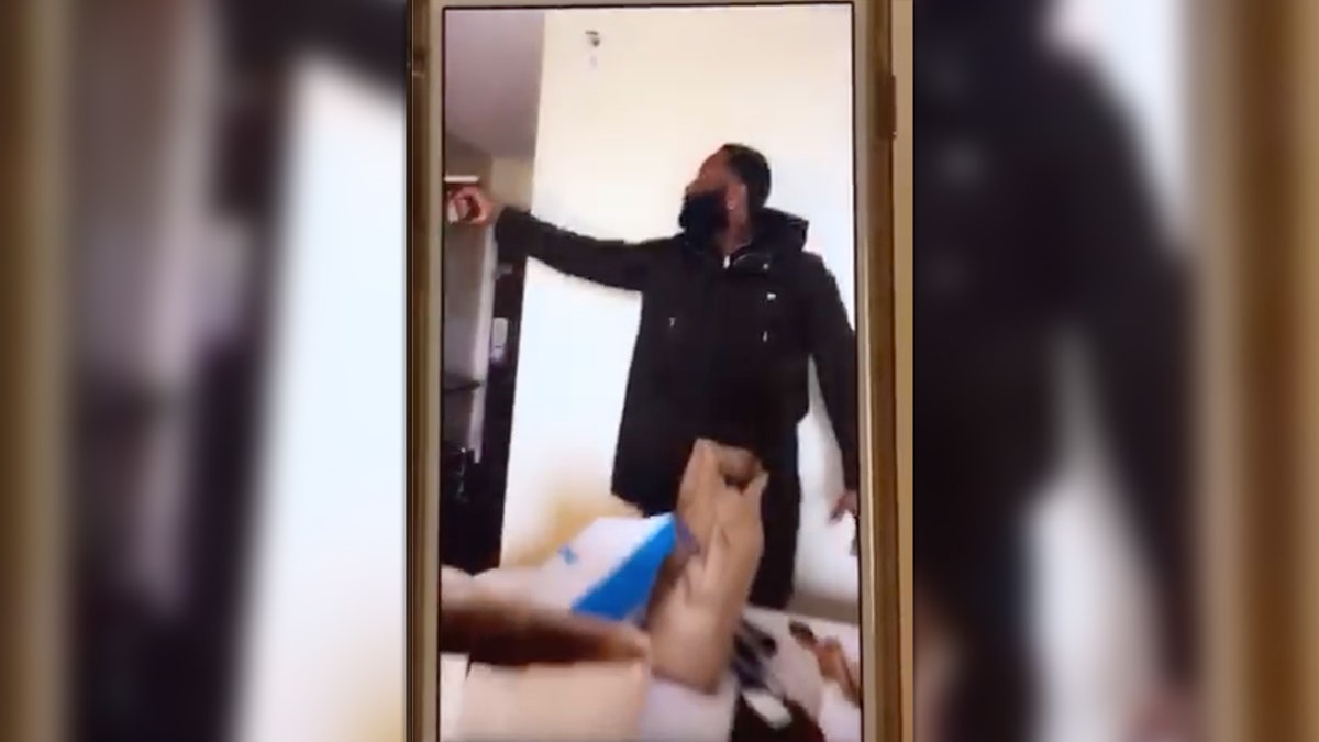 Screenshot from cellphone video that according to federal prosecutors shows Jody Wafer pointing gun in a hotel room as he and Trent Knight rehearsed a kidnapping.