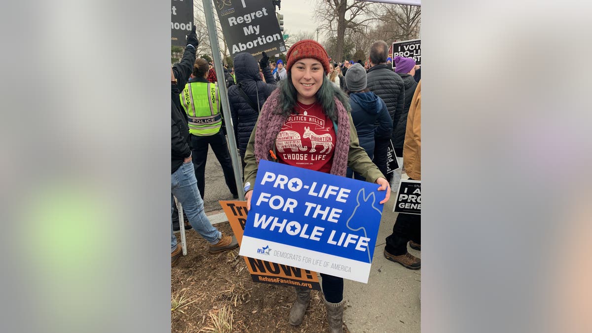 Kristin Vail, 26, holding a Democrats for Life sign outside of the Supreme Court at the 2020 March for Life