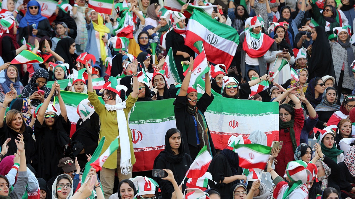 Iranian fans support their national football team during 2022 FIFA World Cup Asia qualifications Group C soccer match between Iran and Cambodia at Azadi Stadium in Tehran, Iran.  The Asian Football Confederation (AFC) has banned the country from hosting international matches. (Photo by Stringer /Anadolu Agency via Getty Images)