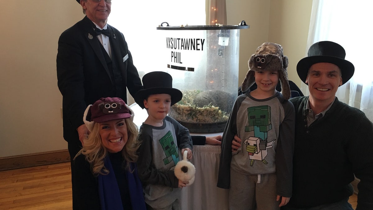 Janice and her family meet Phil the groundhog.