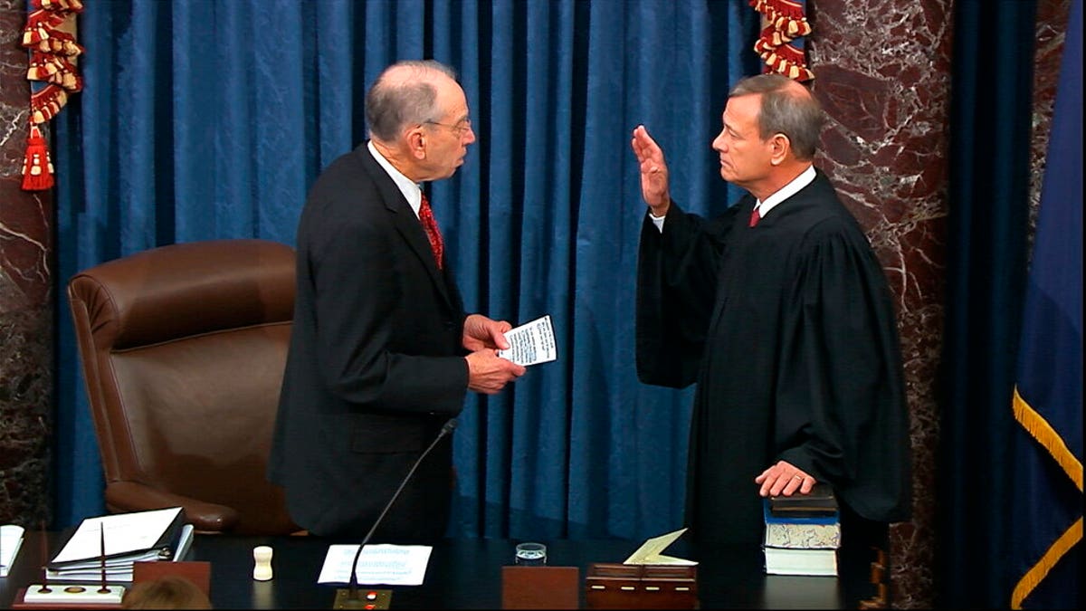 In this image from video, President Pro Tempore of the Senate Sen. Chuck Grassley, R-Iowa., swears in Supreme Court Chief Justice John Roberts as the presiding officer for the impeachment trial of President Trump in the Senate at the U.S. Capitol in Washington, Thursday, Jan. 16, 2020. (Senate Television via AP)
