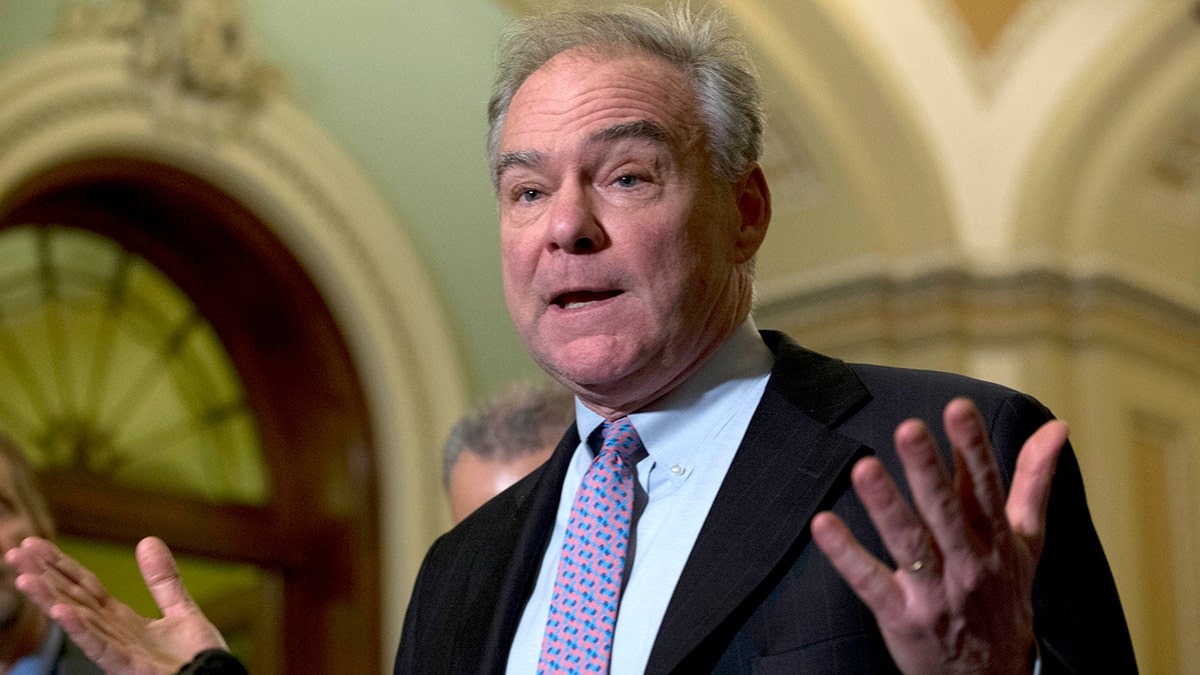 Sen. Tim Kaine D-Va., speaks during a news conference outside of the Senate chamber, on Capitol Hill in Washington, Tuesday, Jan. 14, 2020. (AP Photo/Jose Luis Magana)