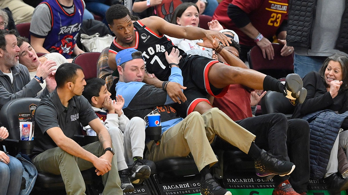 Toronto Raptors guard Kyle Lowry (7) falls in to the stands in the fourth quarter against the Cleveland Cavaliers at Rocket Mortgage FieldHouse. (David Richard-USA TODAY Sports)