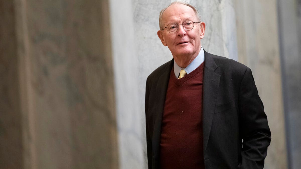 Sen. Lamar Alexander, R-Tenn., arrives on Capitol Hill in Washington, Thursday, Jan. 30, 2020, before the impeachment trial of President Donald Trump. (AP Photo/ Jacquelyn Martin)