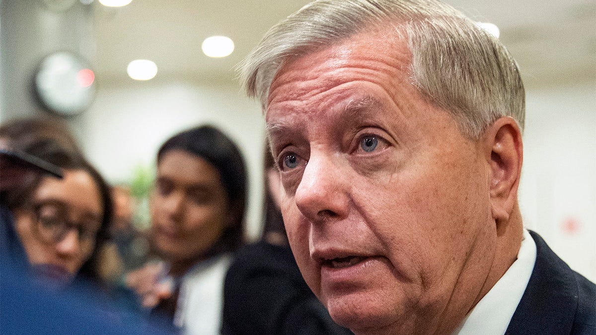 Sen. Lindsey Graham, R-S.C., speaks to reporters as work resumes in the impeachment trial of President Donald Trump on charges of abuse of power and obstruction of Congress on Capitol Hill in Washington, Saturday, Jan. 25, 2020. (AP Photo/Manuel Balce Ceneta)