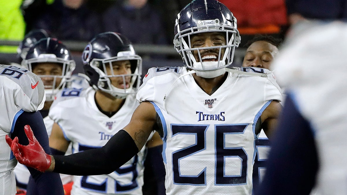 Tennessee Titans cornerback Logan Ryan celebrates his interception for a touchdown against the New England Patriots in the second half of an NFL wild-card playoff football game, Saturday, Jan. 4, 2020, in Foxborough, Mass. (AP Photo/Steven Senne)