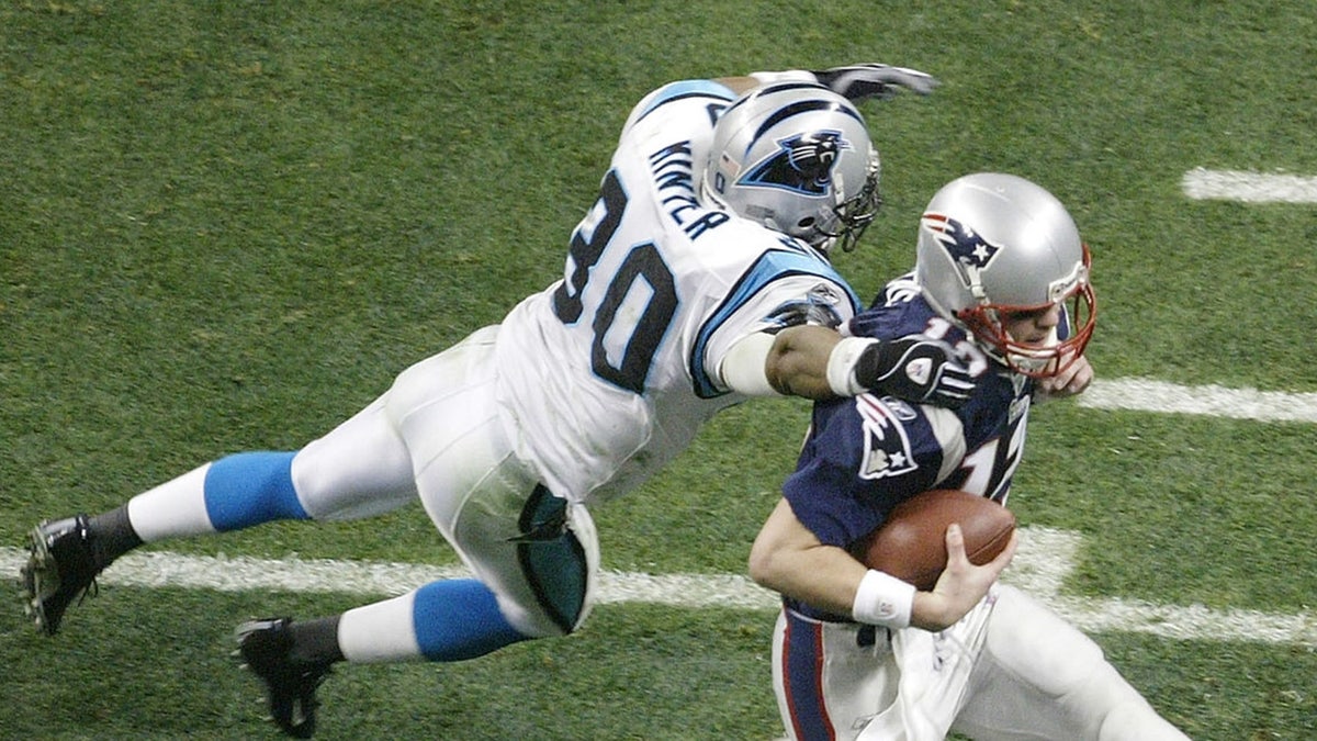 Mike Minter, Will Witherspoon and Dan Morgan were shattering tackling records. (Photo by Jeff Gross/Getty Images)