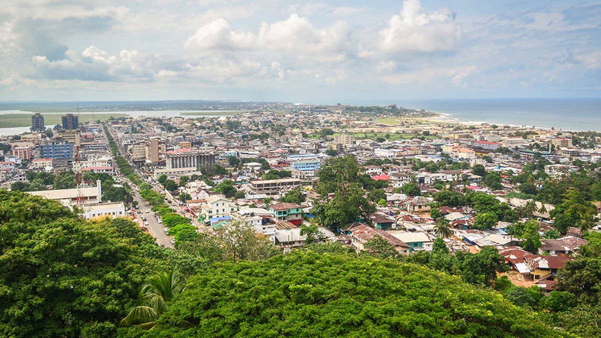 Aerial view of Liberian capital Monrovia, with high-rises and homes and a beach