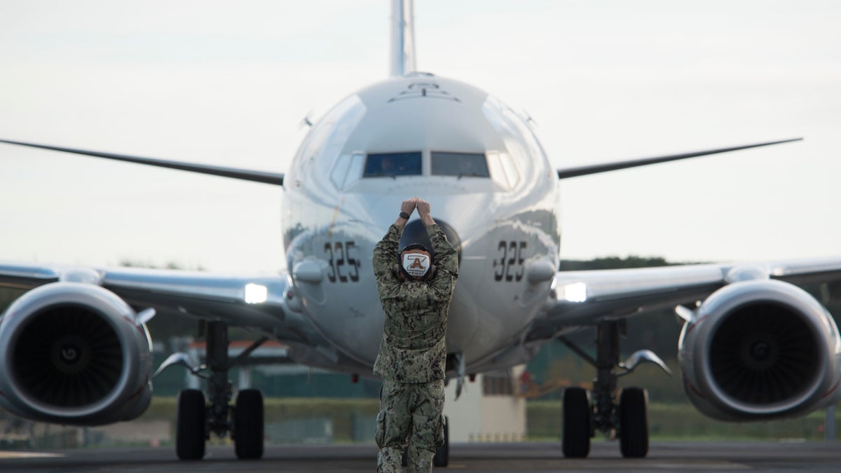 Aviation Maintenance Administrationman 3rd Class Shea Wright, assigned to the Skinny Dragons of Patrol Squadron (VP) 4, recovers a squadron P-8A Poseidon maritime patrol and reconnaissance aircraft following an anti-submarine warfare mission over the Atlantic Ocean, Nov. 30, 2019. - file photo.
