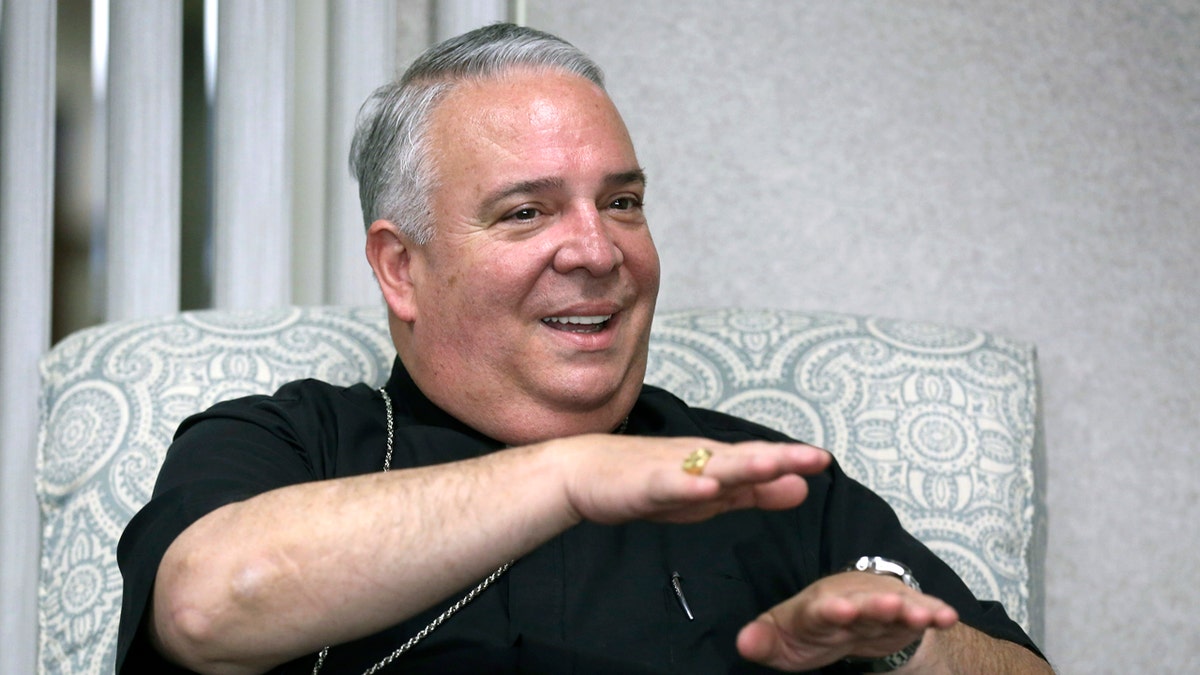 FILE - In this May 30, 2018 file photo, Cleveland Catholic Diocese Bishop Nelson Perez talks during an interview in Cleveland. The Vatican announced Thursday, Jan. 23, 2020, that Perez will become the new leader of the Archdiocese of Philadelphia, making him the first Hispanic archbishop to lead the region’s 1.3 million-member flock. (Lisa DeJong/The Plain Dealer via AP, File)