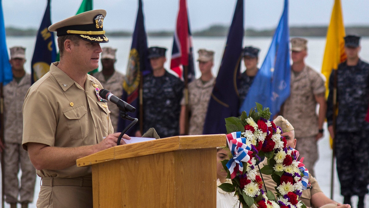 Navy Capt. John R. Nettleton, then-commanding officer of Naval Station Guantanamo Bay, Cuba, spoke during a Battle of Midway commemoration ceremony on June 3, 2014. (Mass Communication Specialist 3rd Class Jacob Goff/U.S. Navy via AP)