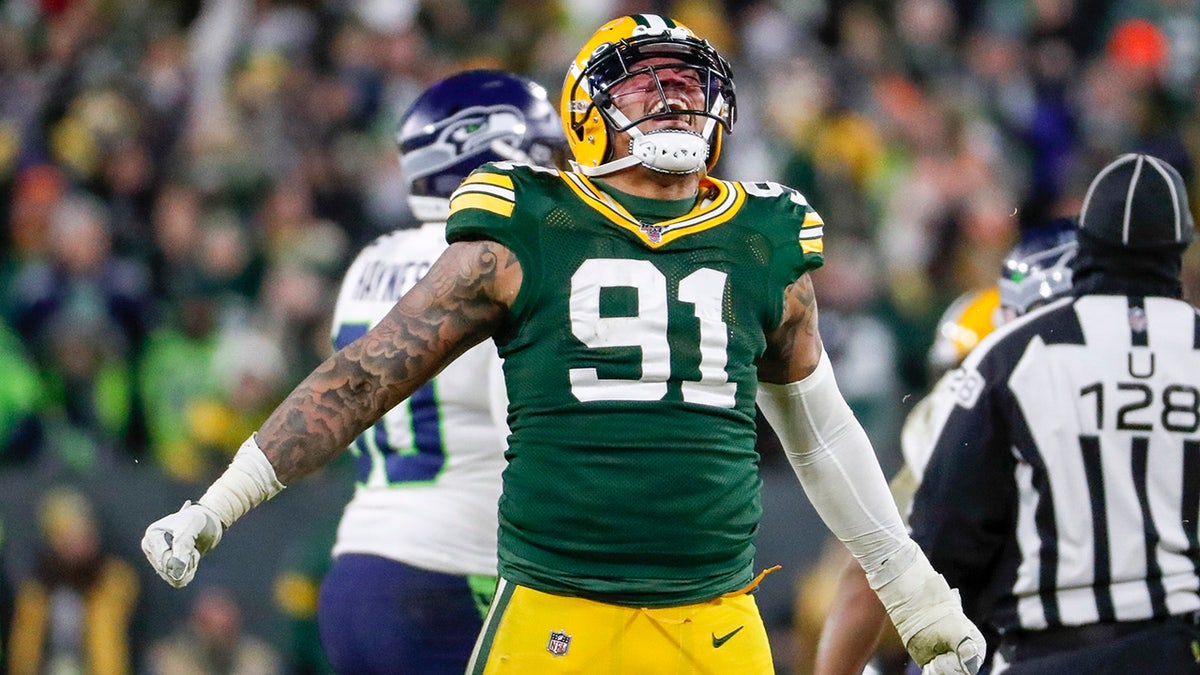 Green Bay Packers' Preston Smith reacts after sacking Seattle Seahawks' Russell Wilson during the second half of an NFL divisional playoff football game Sunday, Jan. 12, 2020, in Green Bay, Wis. (AP Photo/Matt Ludtke)