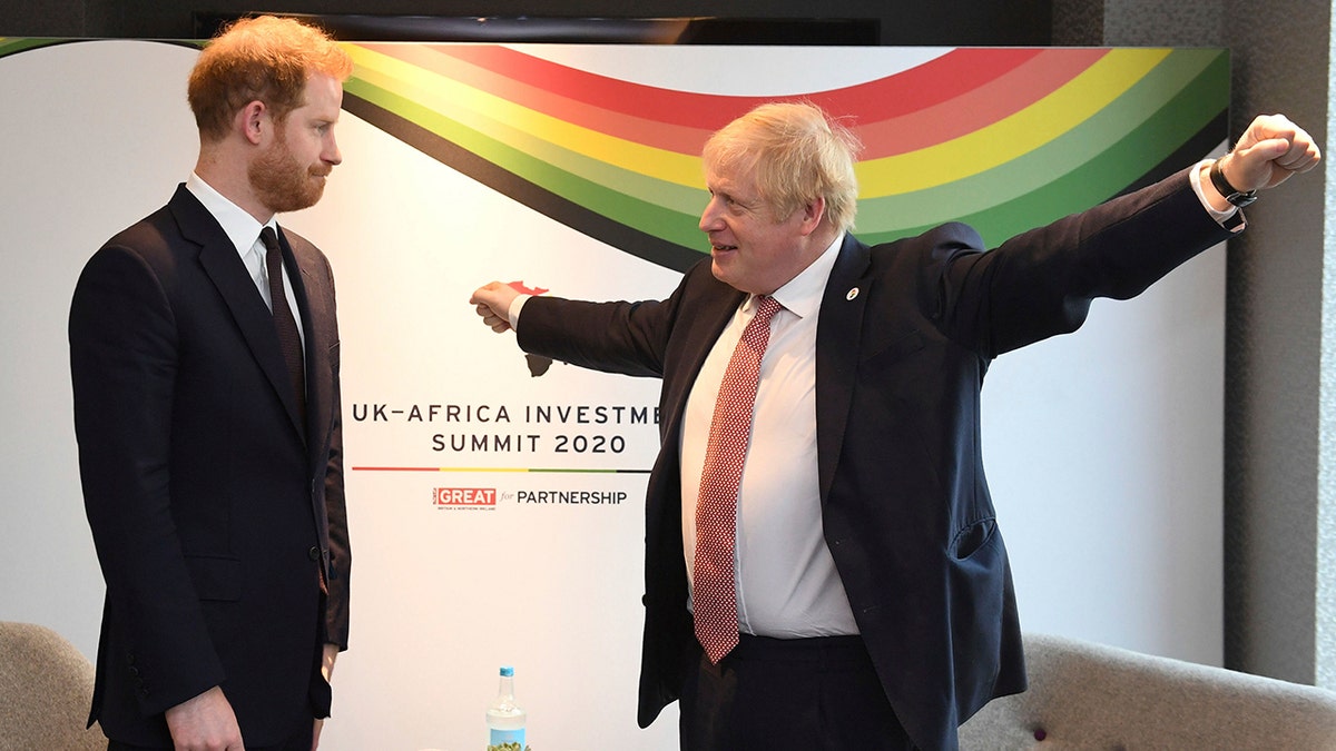 Britain's Prince Harry and Prime Minister Boris Johnson, left, at the UK Africa Investment Summit in London, Monday Jan. 20, 2020. Boris Johnson is hosting 54 African heads of state or government in London. The move comes as the U.K. prepares for post-Brexit dealings with the world. 