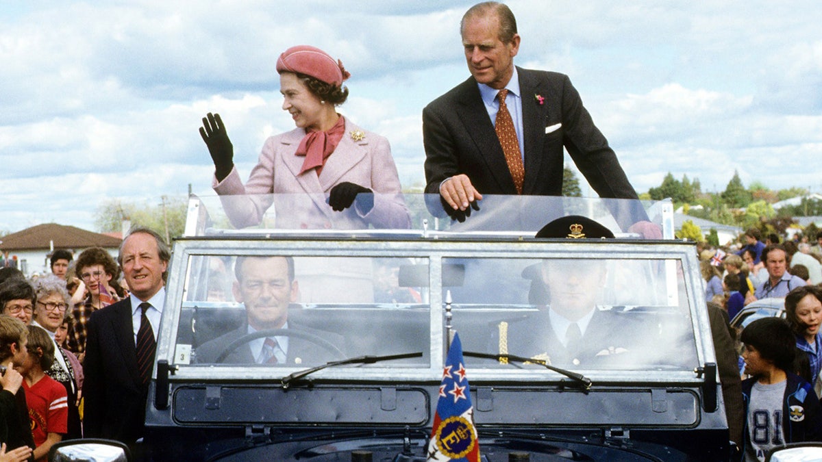 Queen Elizabeth and Prince Philip wave to the crowd during their 1981 tour of New Zealand. It was on this tour where Queen Elizabeth narrowly avoided an attempt on her life.