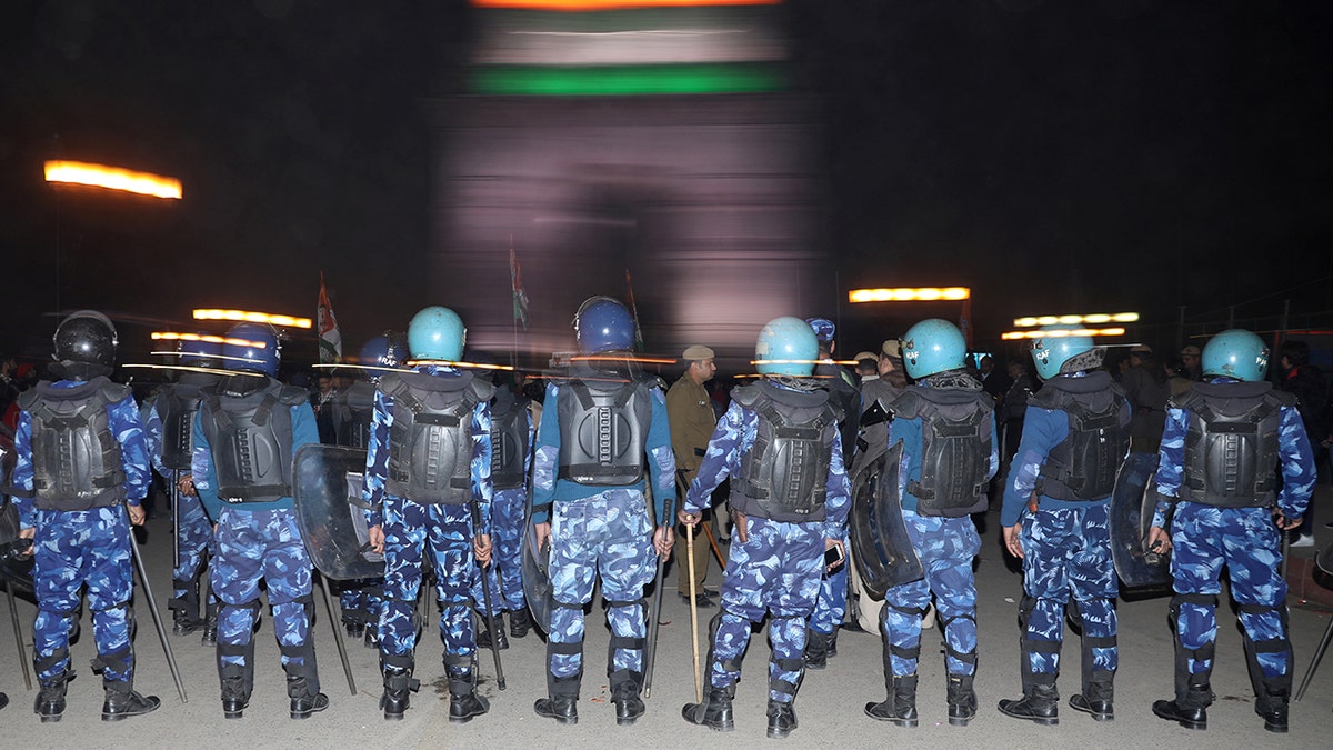 Rapid Action Force (RAF) personnel stand guard as supporters of the youth wing of India's main opposition Congress party protest against the attacks on the students of Jawaharlal Nehru University (JNU) on Sunday, in New Delhi, India, January 6, 2020. REUTERS/Anushree Fadnavis - RC2FAE9PM8YZ