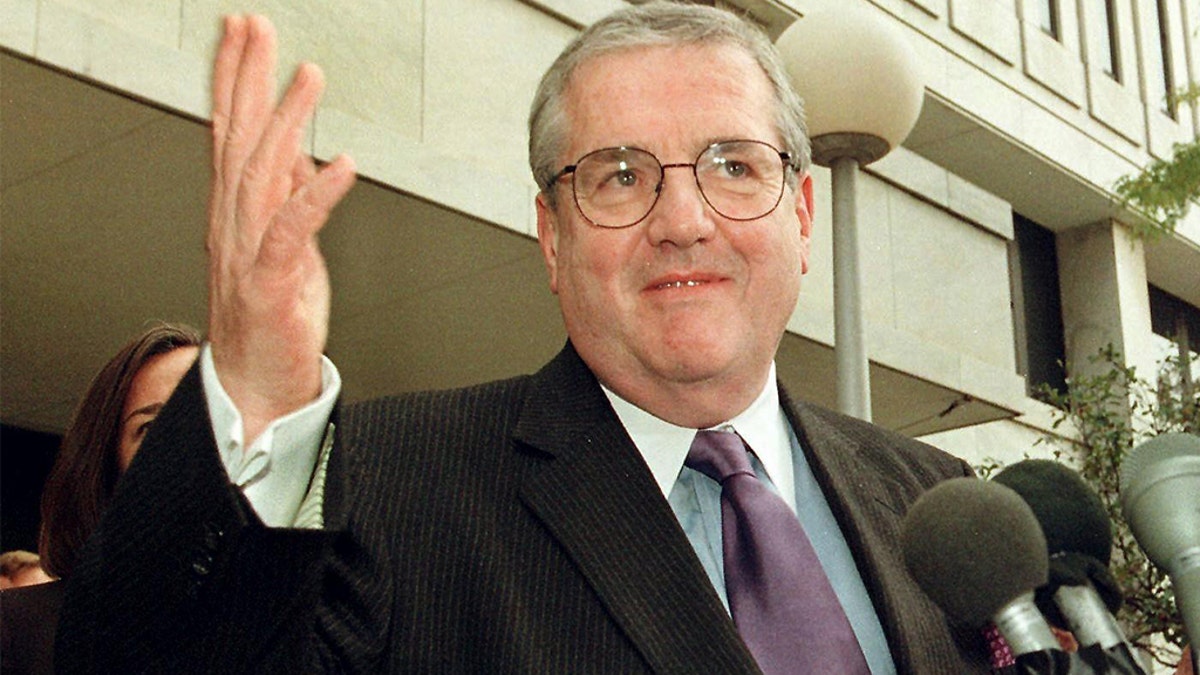 ST. PAUL: Robert Bennett, lead counsel for President Bill Clinton, answers questions outside the Warren E. Burger Federal Building after he and lawyers for Paula Jones squared off in court to argue if Jones' lawsuit should be reinstated Oct. 20 in St. Paul, Minnesota. (Photo credit: CRAIG LASSIG/AFP via Getty Images)