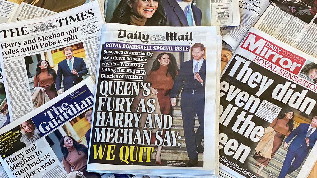 An arrangement of UK daily newspapers photographed in London on January 9, 2020, shows front-page headlines reporting on the news that Britain's Prince Harry, Duke of Sussex and his wife Meghan, Duchess of Sussex, plan to step back as 'senior' members of the Royal Family. 