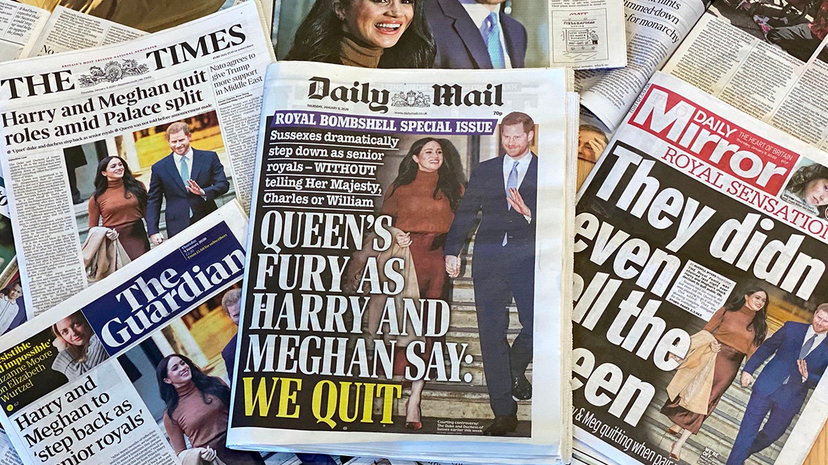 An arrangement of UK daily newspapers photographed in London on January 9, 2020, shows front-page headlines reporting on the news that Britain's Prince Harry, Duke of Sussex and his wife Meghan, Duchess of Sussex, plan to step back as 'senior' members of the Royal Family.?