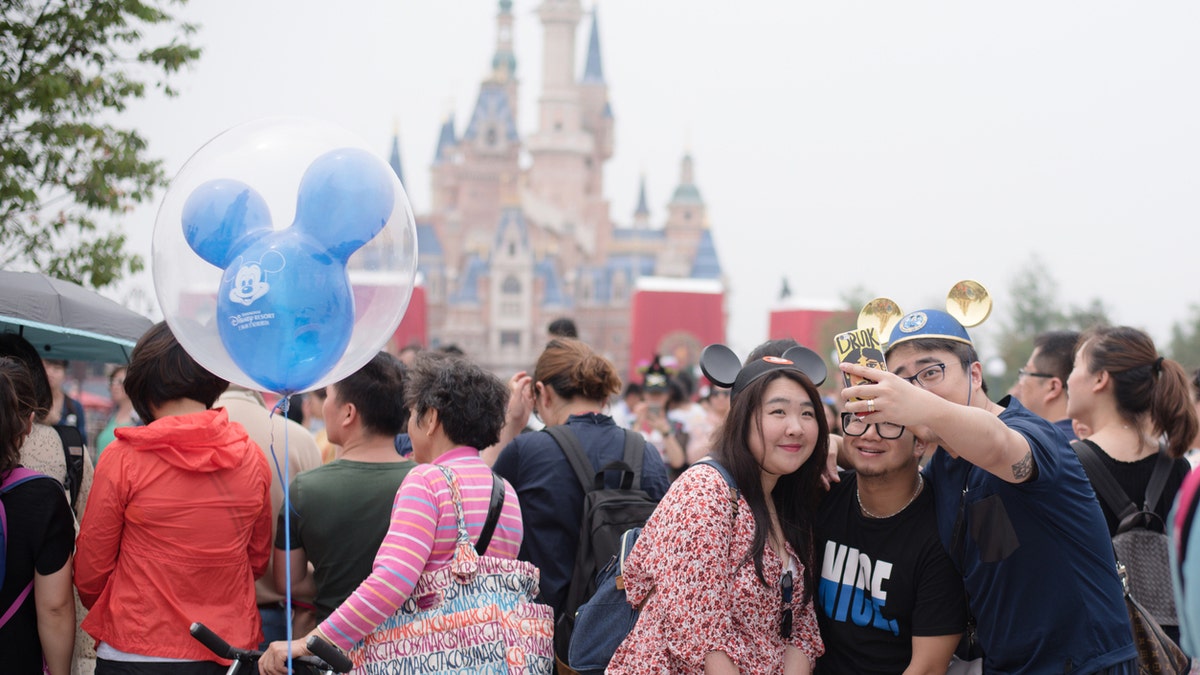 Amid the ongoing outbreak, Disney’s signature theme parks in Hong Kong and Shanghai, pictured, remain temporarily closed