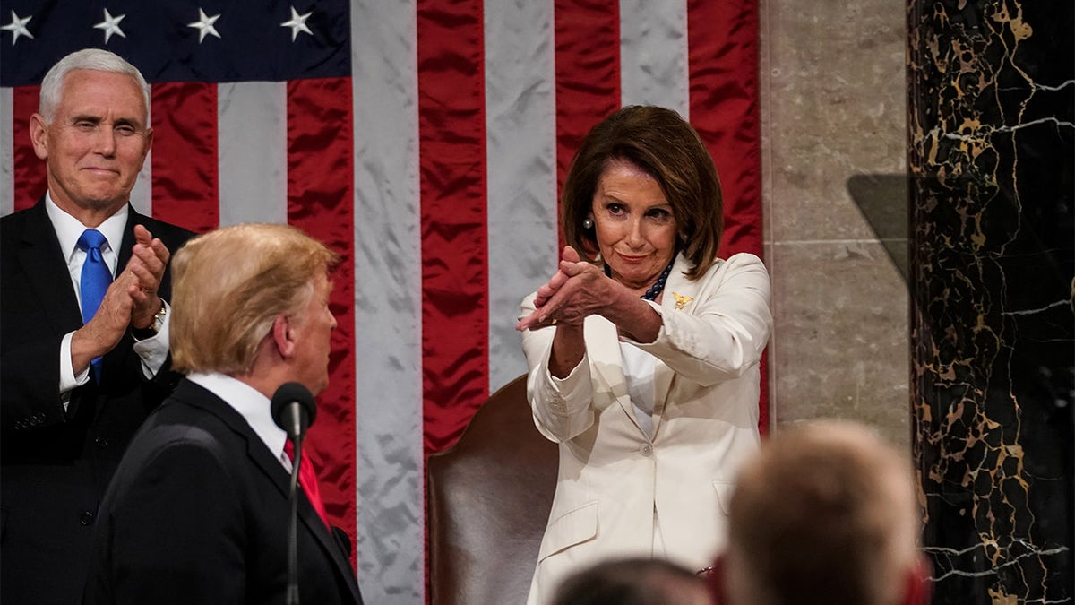 Pelosi claps at Donald Trump