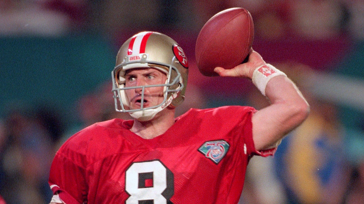 Steve Young #8 of the San Francisco 49ers drops back to pass against the San Diego Chargers during Super Bowl XXIX on January 29, 1995 at Joe Robbie Stadium in Miami, Florida. The Niners won the Super Bowl 49-26. (Photo by Focus on Sport/Getty Images)