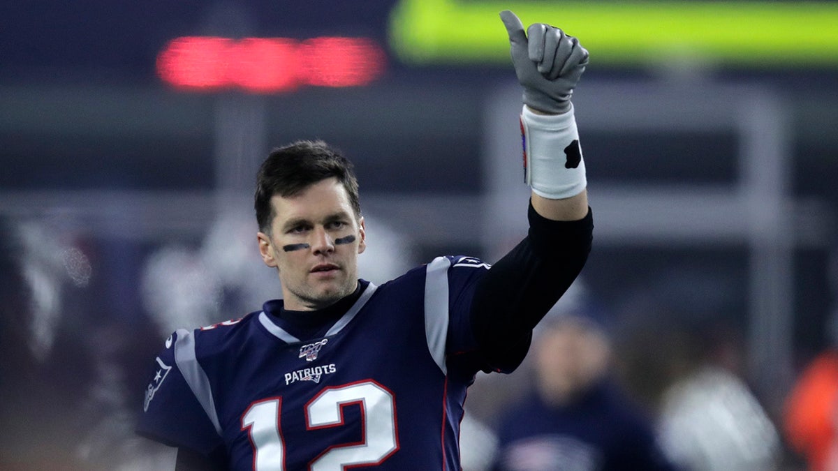 New England Patriots quarterback Tom Brady signals to a teammate before an NFL wild-card playoff football game against the Tennessee Titans, Saturday, Jan. 4, 2020, in Foxborough, Massachusetts.