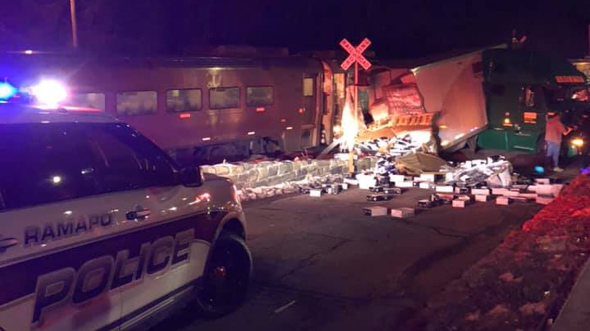 The scene after a Metro-North commuter train struck a tractor-trailer at a railroad crossing.