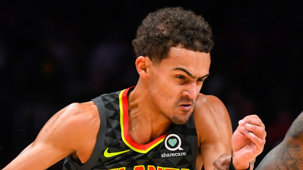 Atlanta Hawks guard Trae Young drives against Indiana Pacers guard Edmond Sumner during the first half of an NBA basketball game Saturday, Jan. 4, 2020, in Atlanta. (AP Photo/John Amis)