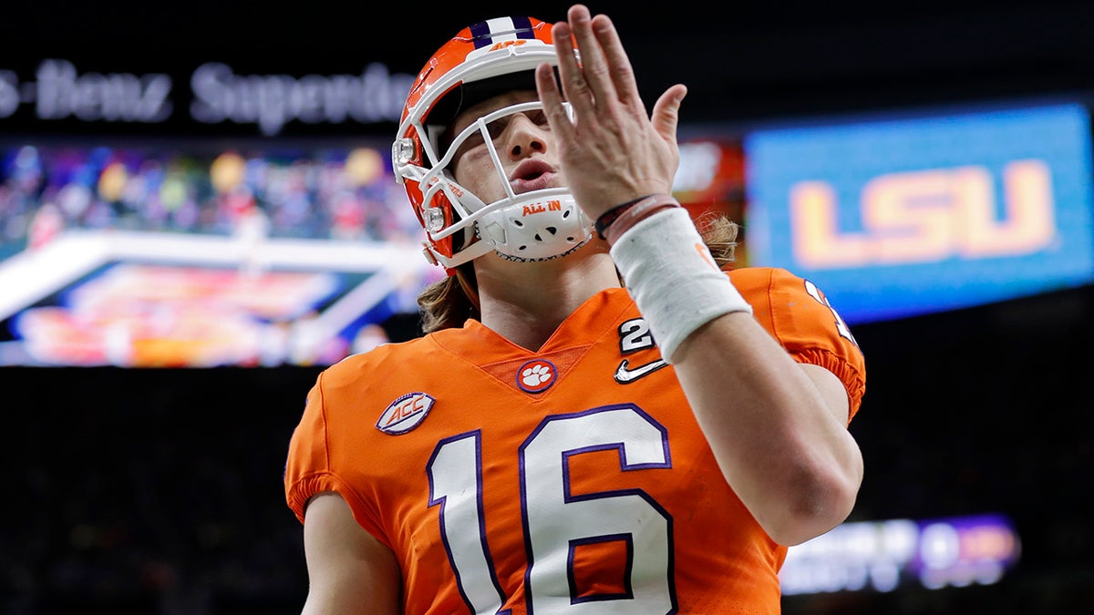 Clemson quarterback Trevor Lawrence celebrates after scoring during the first half of a NCAA College Football Playoff national championship game against LSU Monday, Jan. 13, 2020, in New Orleans. (AP Photo/Gerald Herbert)