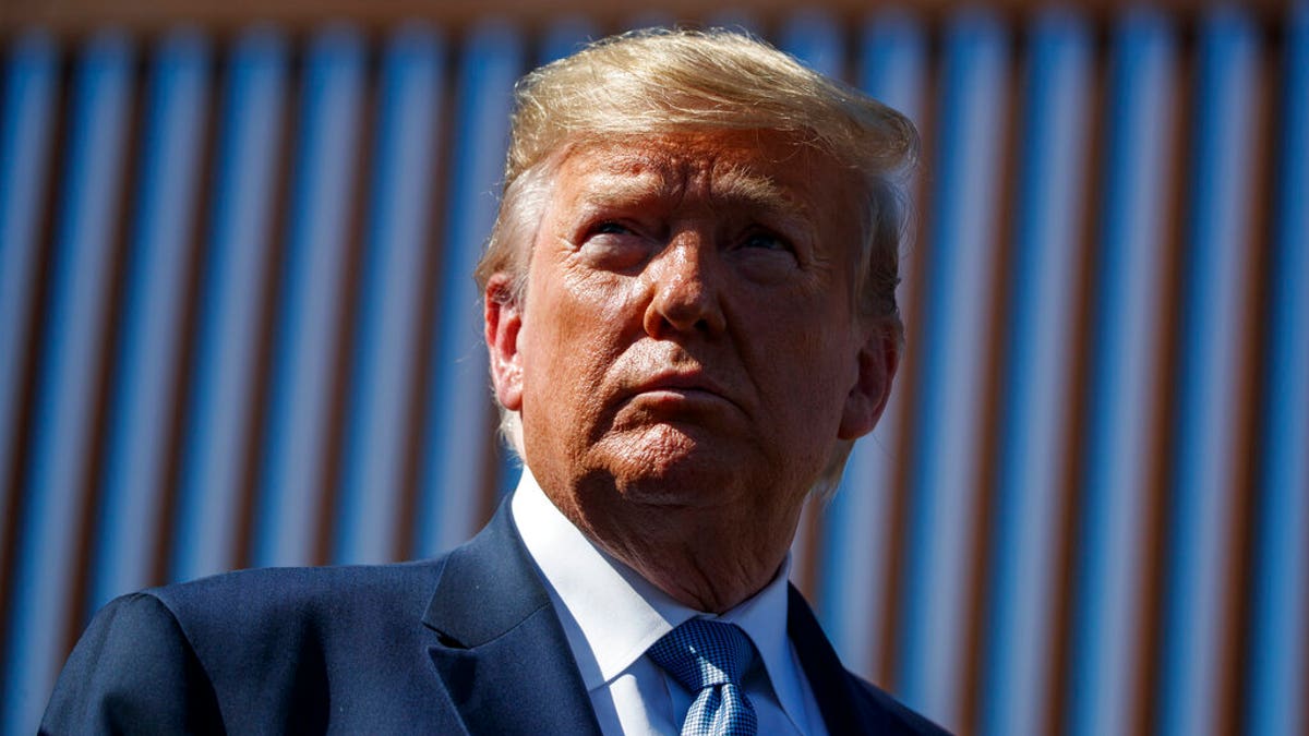 President Donald Trump tours a section of the southern border wall, Wednesday, Sept. 18, 2019, in Otay Mesa, Calif. (AP Photo/Evan Vucci)
