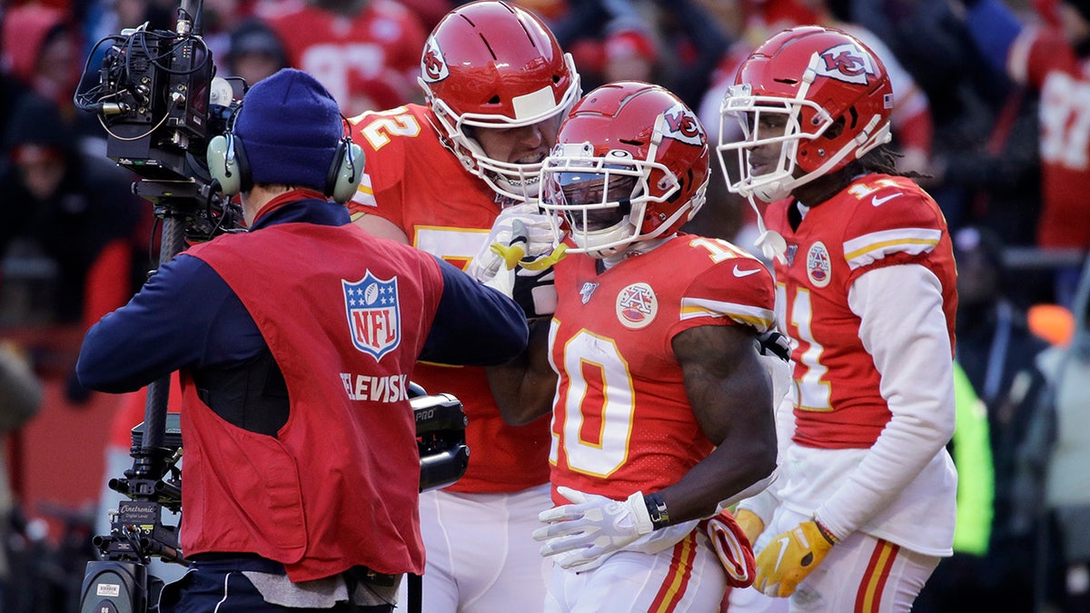 Kansas City Chiefs' Tyreek Hill (10) celebrates his touchdown catch during the first half of the NFL AFC Championship football game against the Tennessee Titans Sunday, Jan. 19, 2020, in Kansas City, MO. (AP Photo/Charlie Riedel)