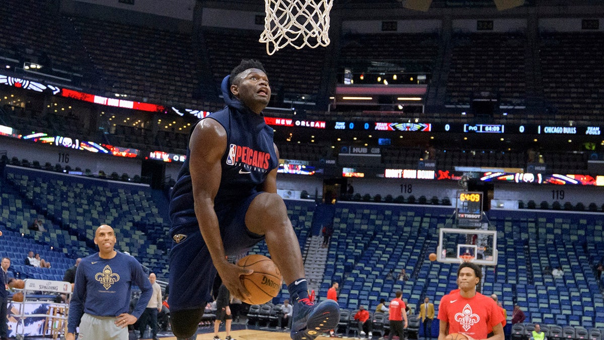 New Orleans Pelicans forward Zion Williamson goes to the basket before the start of an NBA basketball game against the Chicago Bulls in New Orleans, Wednesday, Jan. 8, 2020. Williamson is not scheduled to play. (AP Photo/Matthew Hinton)