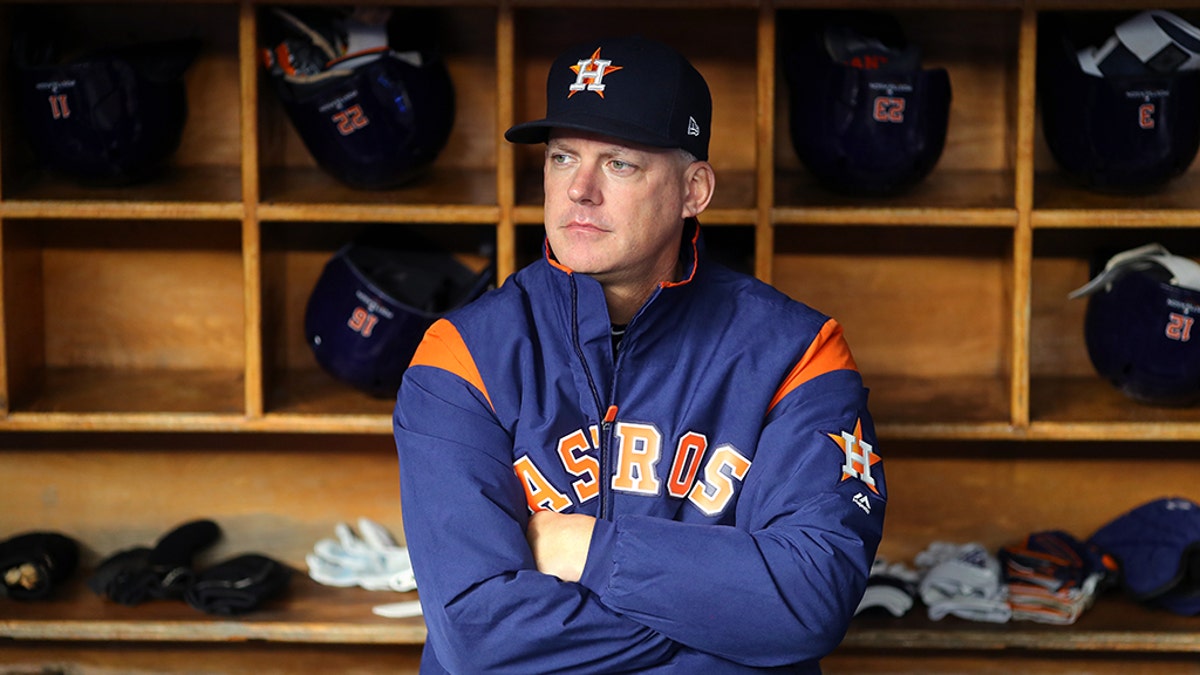 Manager AJ Hinch #14 of the Houston Astros looks on from the dugout prior to Game 5 of the ALCS between the Houston Astros and the New York Yankees at Yankee Stadium on Friday, October 18, 2019 in the Bronx borough of New York City. (Photo by Alex Trautwig/MLB Photos via Getty Images)