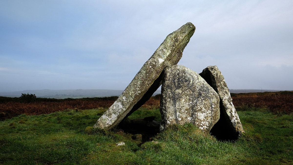 Graffiti which is thought to depict two alien figures has appeared on the ancient site of Mulfra Quoit in West Cornwalll. Vandals have caused fury by painting two ALIENS on stones at an ancient site. (Credit: SWNS)