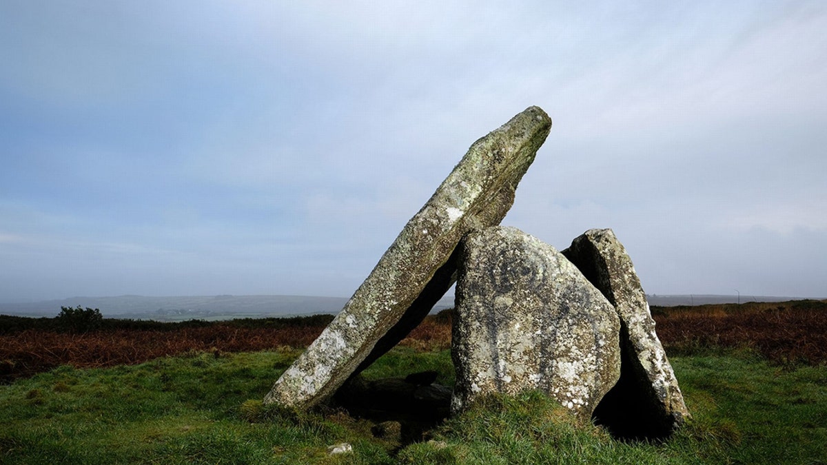 Graffiti which is thought to depict two alien figures has appeared on the ancient site of Mulfra Quoit in West Cornwalll. Vandals have caused fury by painting two ALIENS on stones at an ancient site. (Credit: SWNS)