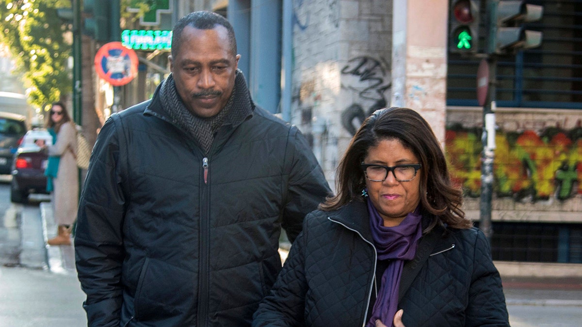 Phil and Jill Henderson, parents of Bakari Henderson, arrived at the court in Patras city, Greece, on Wednesday ahead of the expected retrial. (AP Photo/Andreas Alexopoulos)