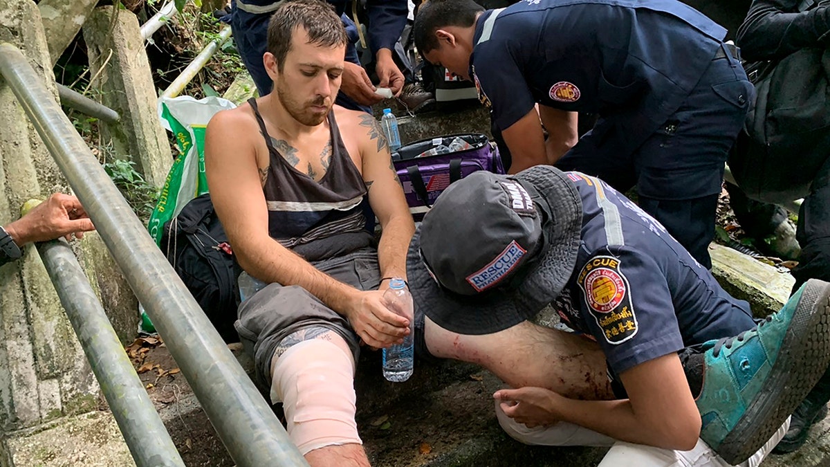 Grasser was treated for minor injuries after being rescued from the edge of a cliff. (Phatthalung Rescue Organization via AP)
