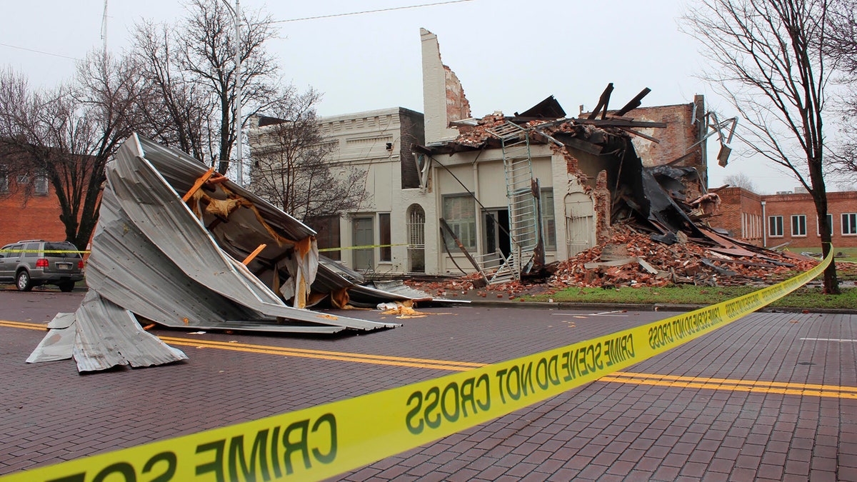 Severe storms sweeping across parts of the U.S. South were blamed for deaths and destruction, such as this unoccupied business on Main Street in downtown Greenville, Miss. on Saturday.