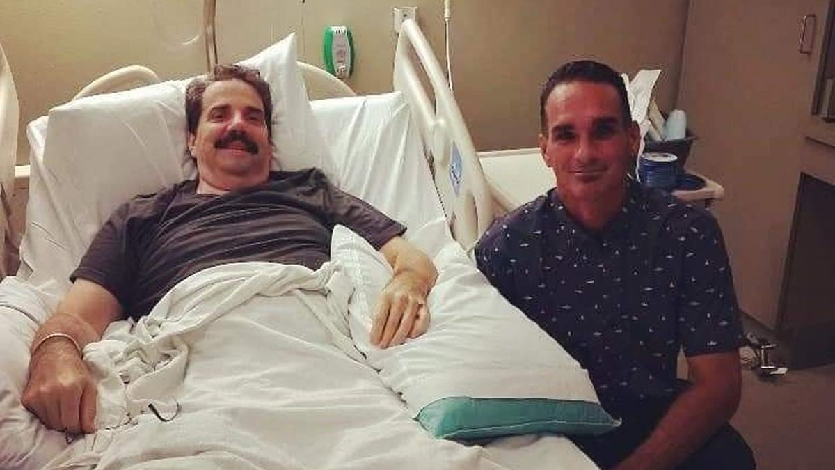 Jack Keith (right) visiting Tom Sovilla in the hospital.