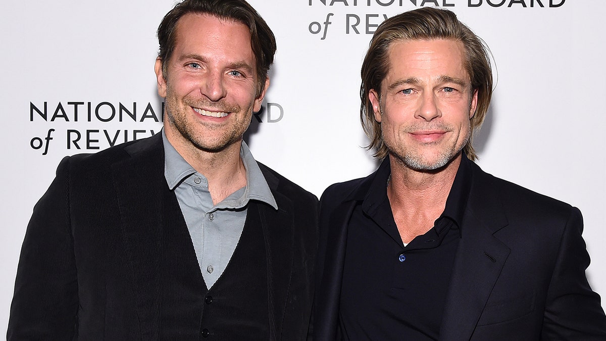 Bradley Cooper and Brad Pitt stand side-by-side during awards season