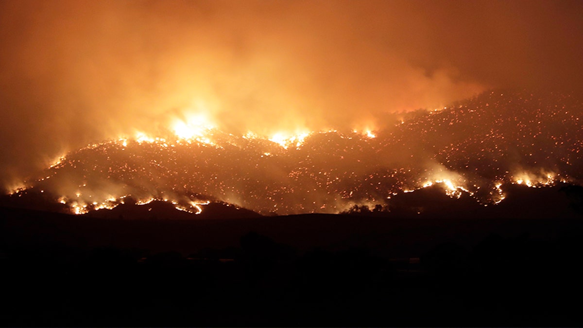 A blaze on Canberra's southern fringe that has razed more than 53,000 acres since it was sparked by heat from a military helicopter landing light on Monday, officials say.