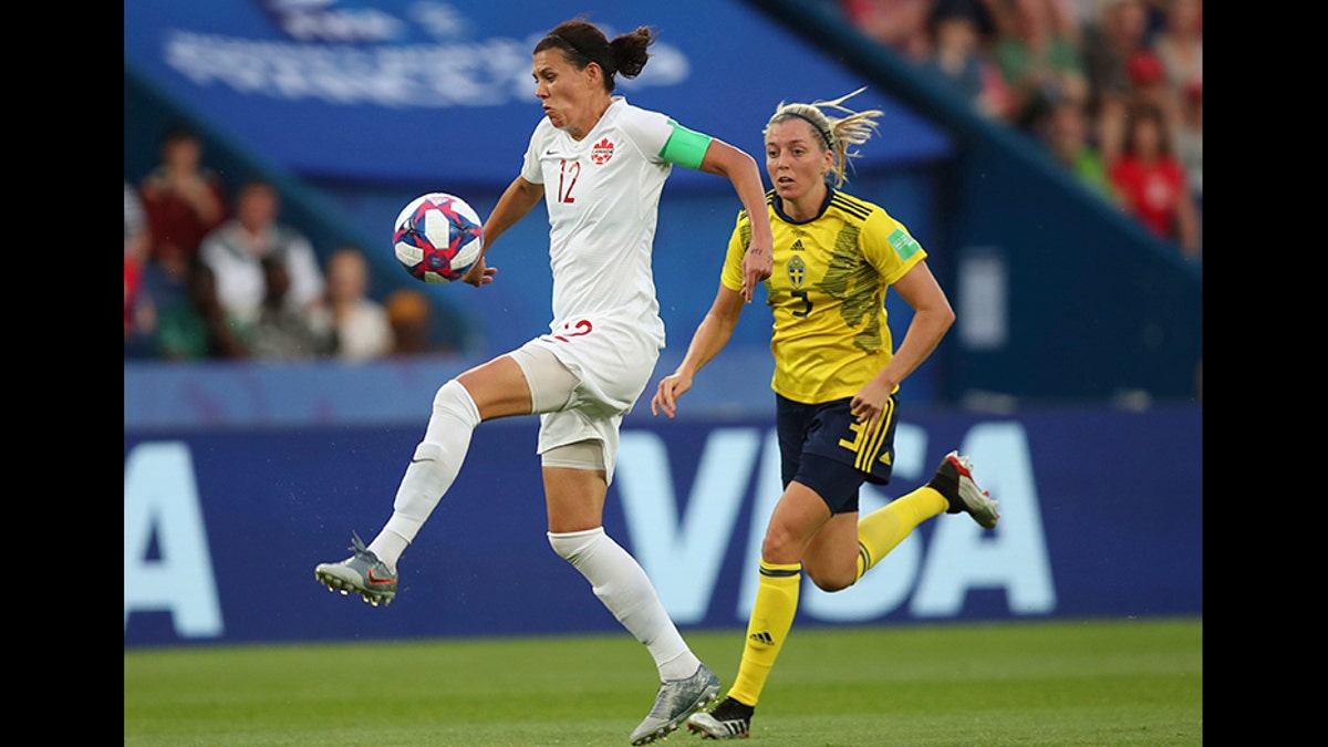 Canada's Christine Sinclair, left, is chased down by Sweden's Linda Sembrant during a Women's World Cup round of 16 soccer match in Paris, France, in June 2019.