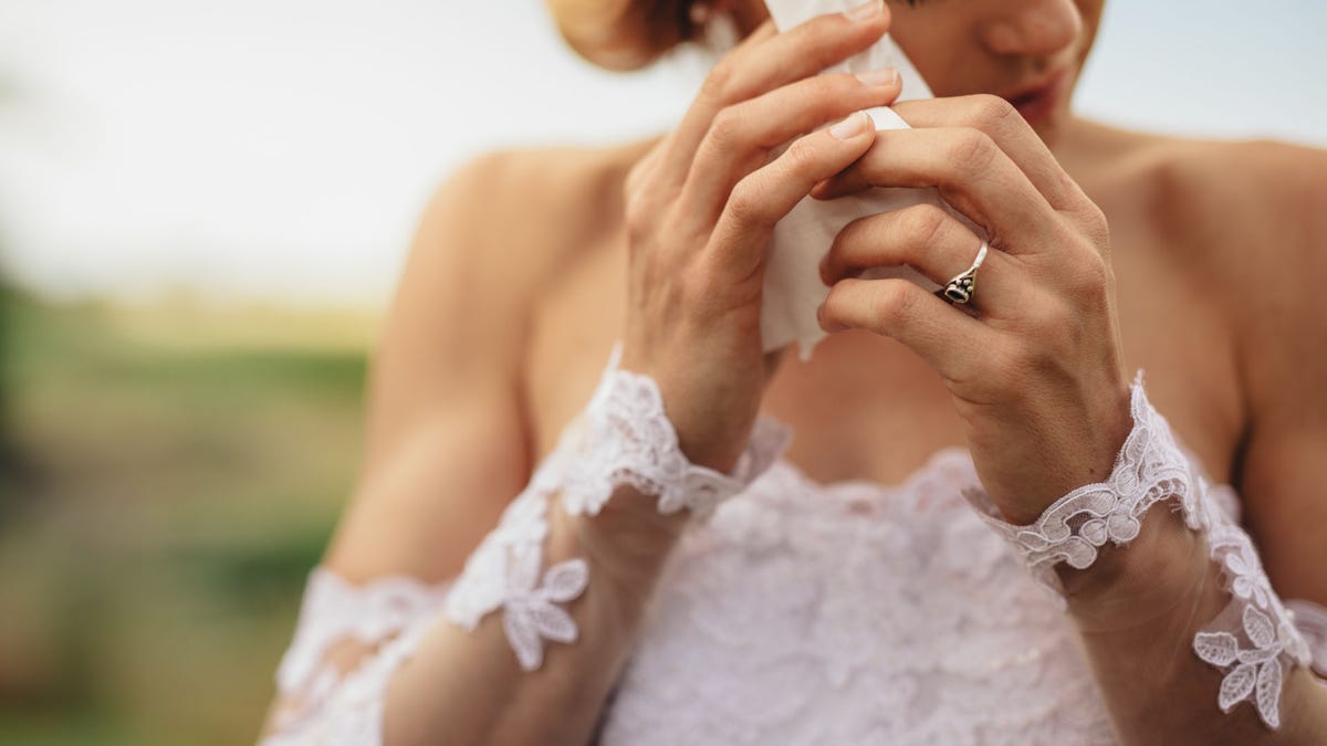 Emotional bride weeps tears of happiness