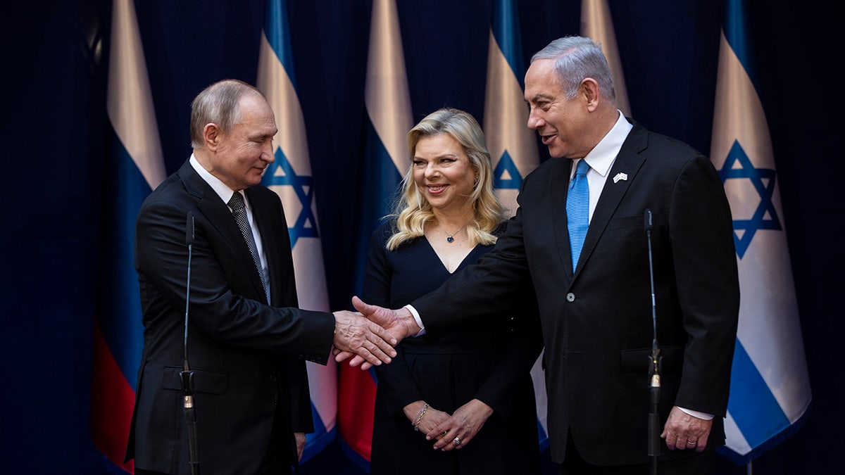 Israeli Prime Minister Benjamin Netanyahu and his wife Sarah meet with Russian President Vladimir Putin, left, at Netanyahu official residence in Jerusalem on Thursday, Jan. 23, 2020. Putin will be a guest of honor Thursday at a ceremony at the Yad Vashem Holocaust Museum marking the 75th anniversary of the Soviet Red Army's liberation of the Nazi Auschwitz death camp. (Heidi Levine/Pool photo via AP)